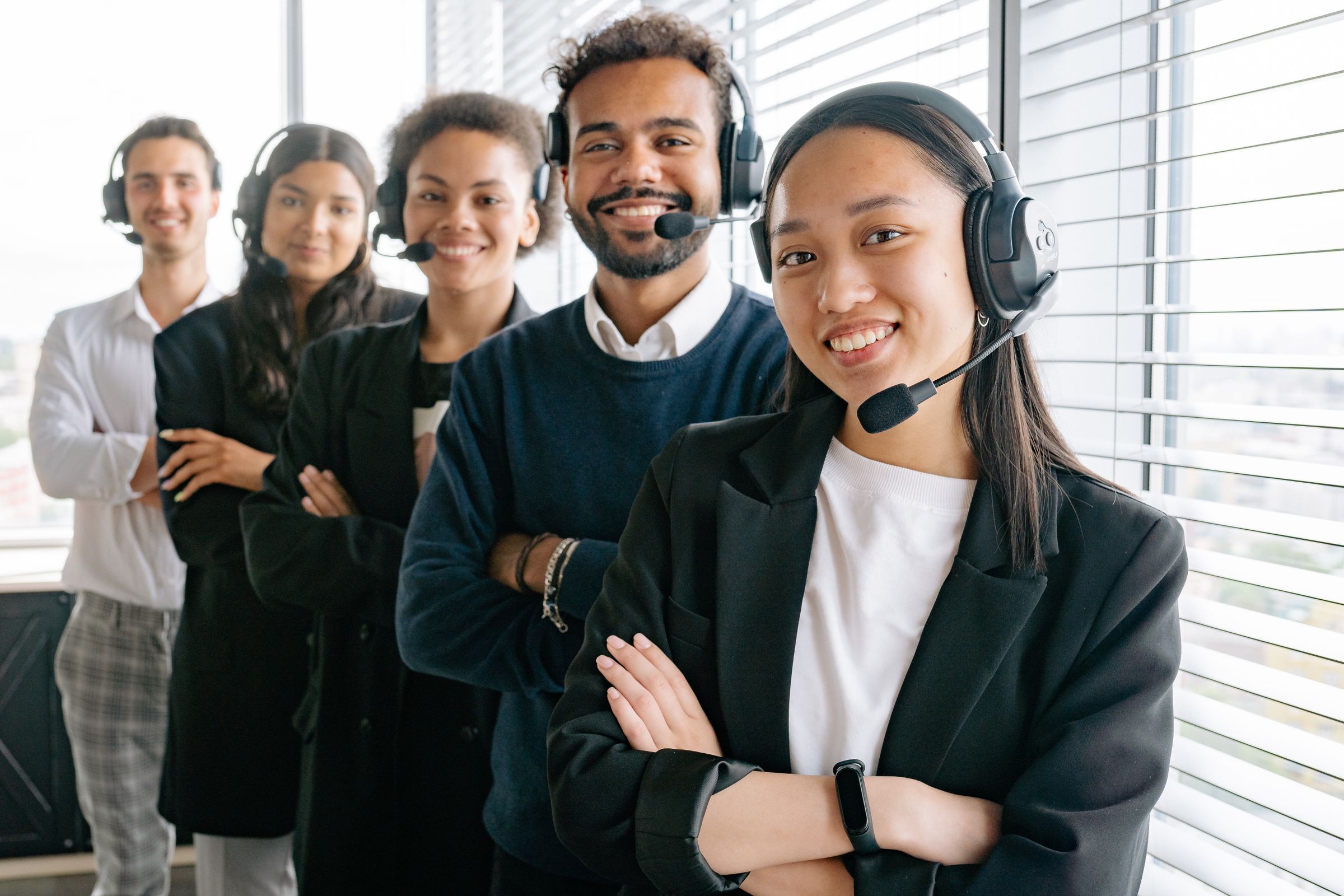 Support team wearing headsets at their desks